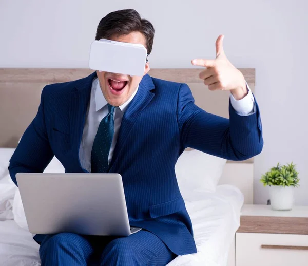 stock image Businessman wearing a virtual reality headset in the bedroom