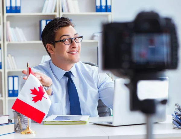 Blogger doing webcast on canadian immigration to Canada — Stock Photo, Image