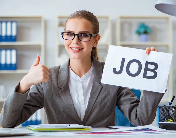 Businesswoman sitting in office with message — Stock Photo, Image