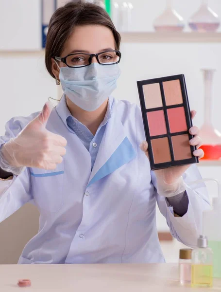 Lab chemist checking beauty and make-up products