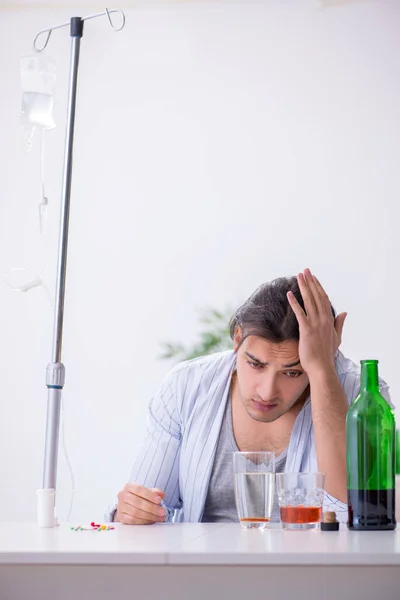 Young man in alcohol addiction treatment concept — Stock Photo, Image