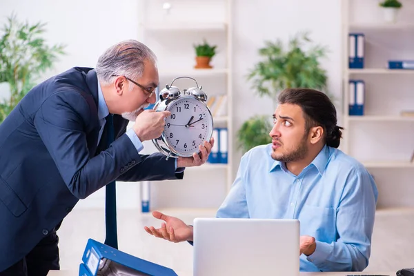 Old boss and his young assistant in the office — Stock Photo, Image