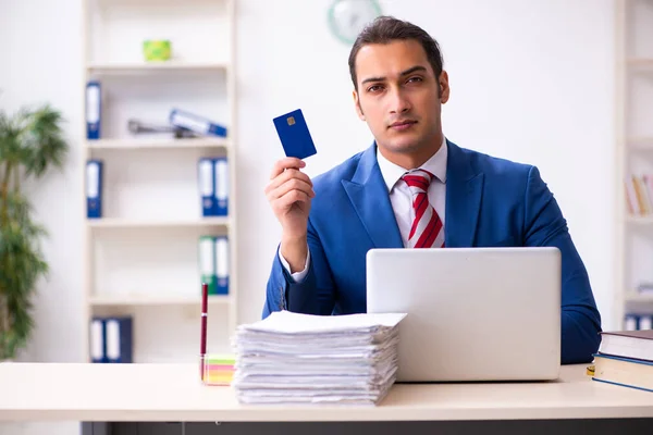 Young male employee working in the office — Stock Photo, Image