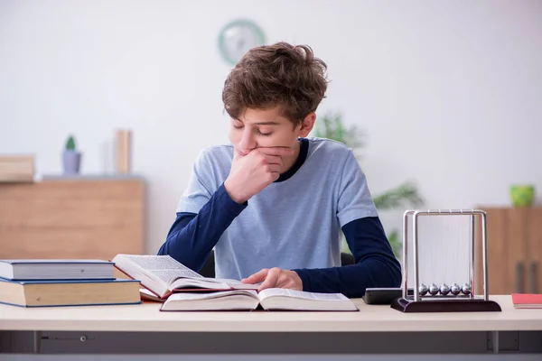 Schoolboy studying physics at home — Stock Photo, Image