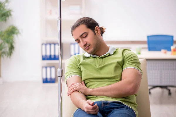 Young male patient in blood transfusion concept — Stock Photo, Image