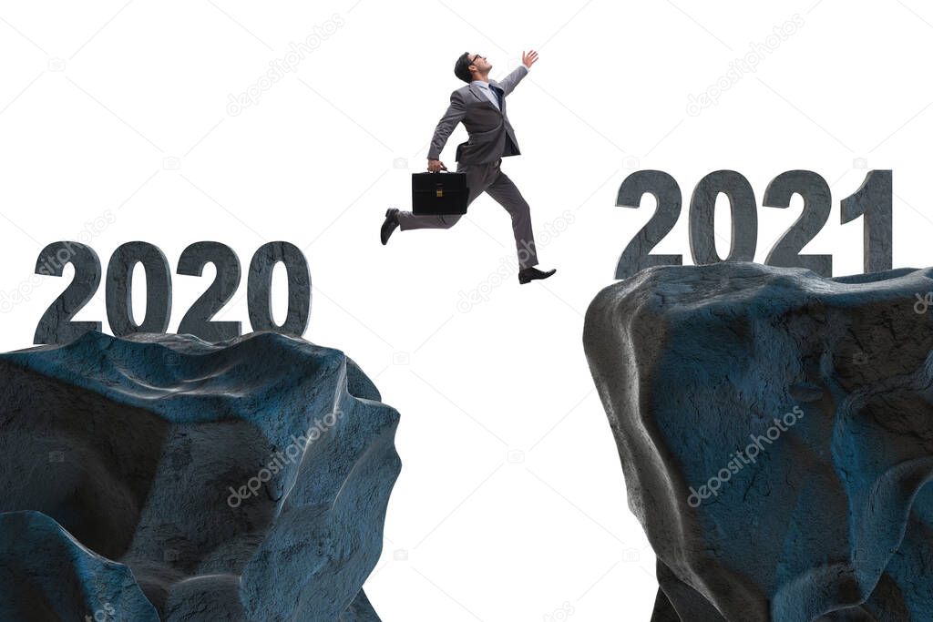 Businessman jumping from the year 2020 to 2021