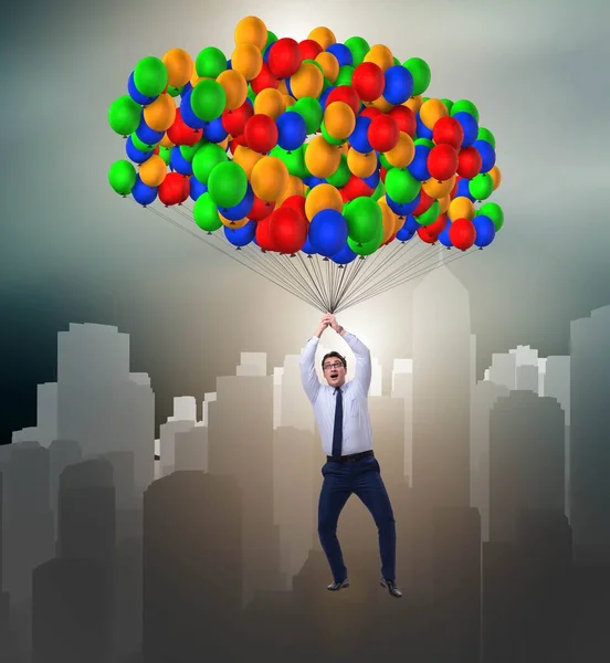 Бізнесмен літає на повітряних кулях у концепції виклику — стокове фото