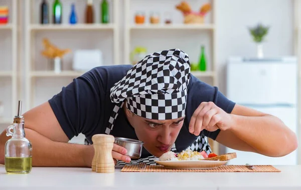 Chef cook cooking a meal breakfast dinner in the kitchen — Stock Image Chef cook cooking a meal breakfast dinner in the kitchen Royalty Free Stock Images