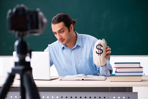 Young handsome teacher recording video for his blog — Stock Photo, Image