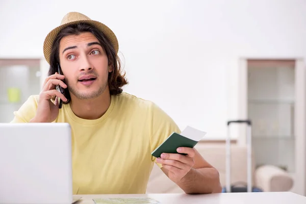 Young man holding passport preparing for summer trip — Stock Photo, Image