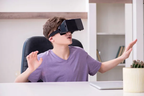 Schoolboy wearing virtual glasses at home — Stock Photo, Image