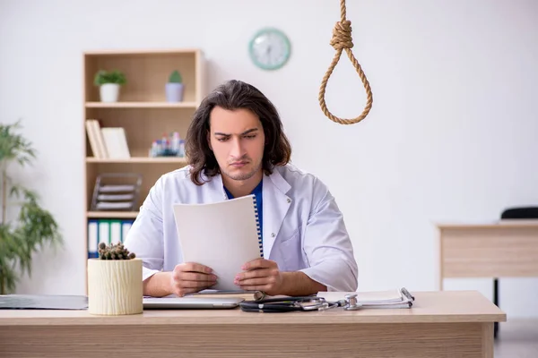 Young male doctor committing suicide in the hospital — Stock Photo, Image