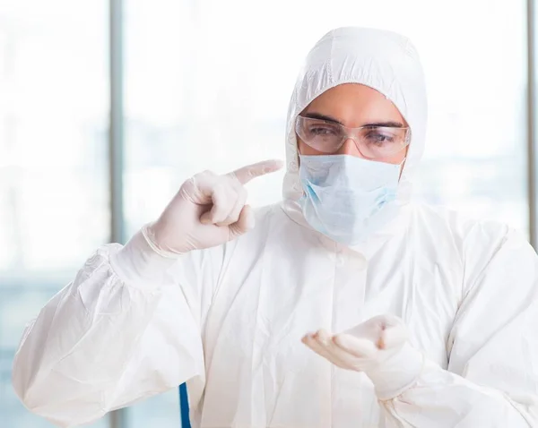 stock image Young chemist student working in lab on chemicals