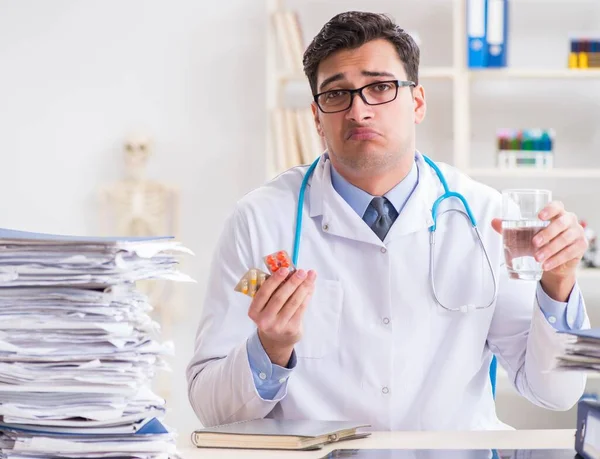 Busy doctor with too much work in hospital — Stock Photo, Image