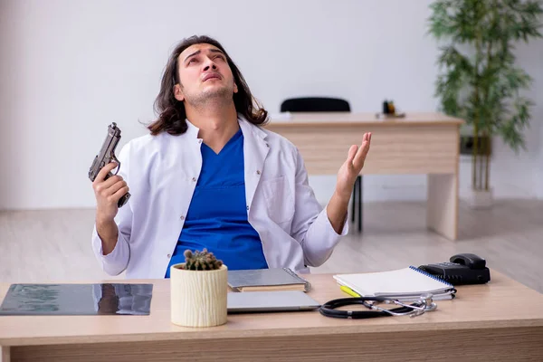 Young male doctor committing suicide in the hospital — Stock Photo, Image