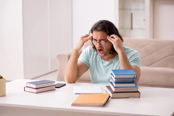 Young male student preparing for exams at home — Stock Photo, Image