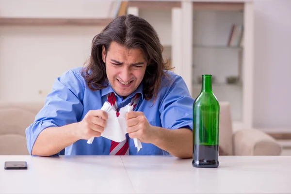 Young male employee being fired from his work at home — Stock Photo, Image