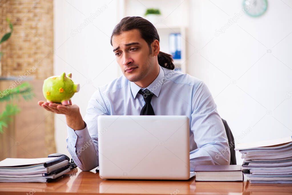 Young male employee in payment concept