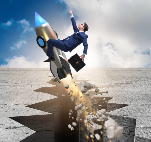Businessman flying on rocket from rock gap — Stock Photo, Image