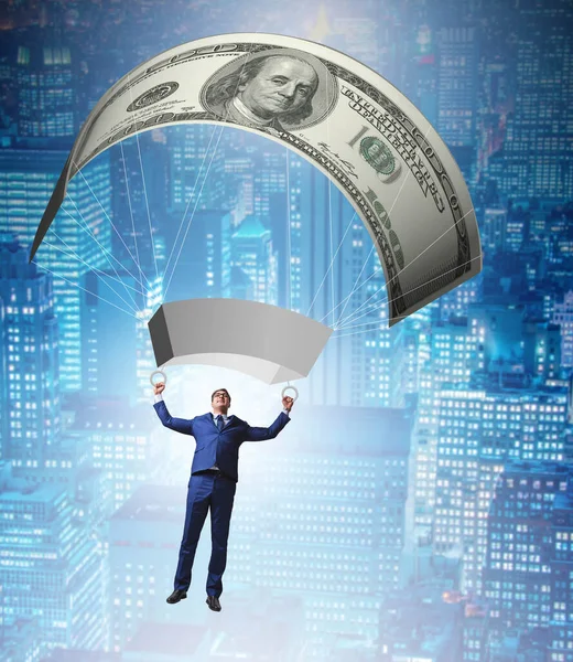 Businessman in golden parachute concept