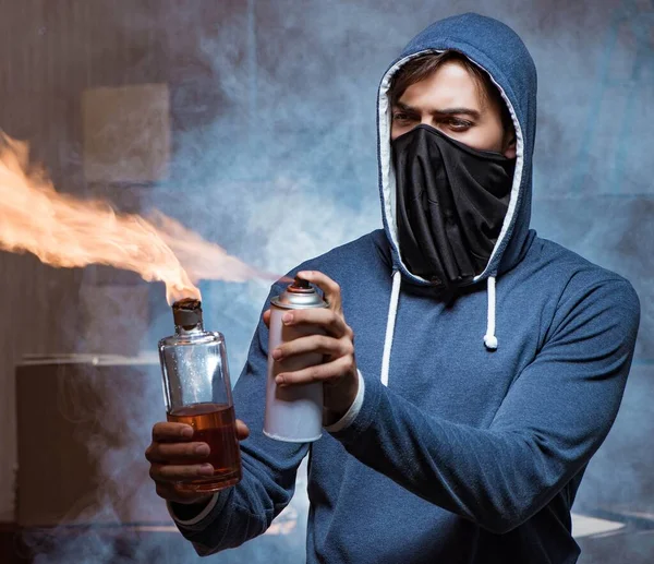 Rebel with molotov cocktail in dark room — Stock Photo, Image