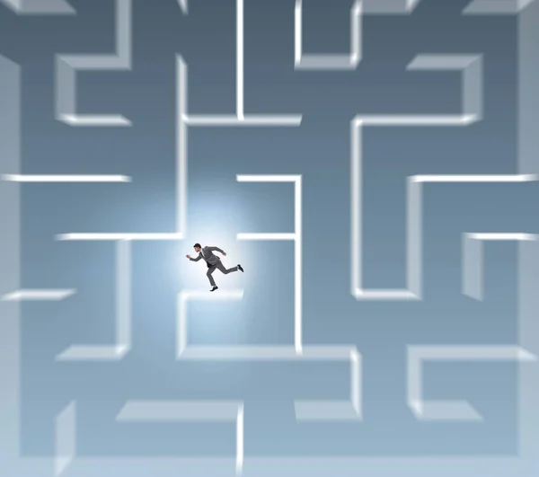 Businessman trying to escape from maze labyrinth