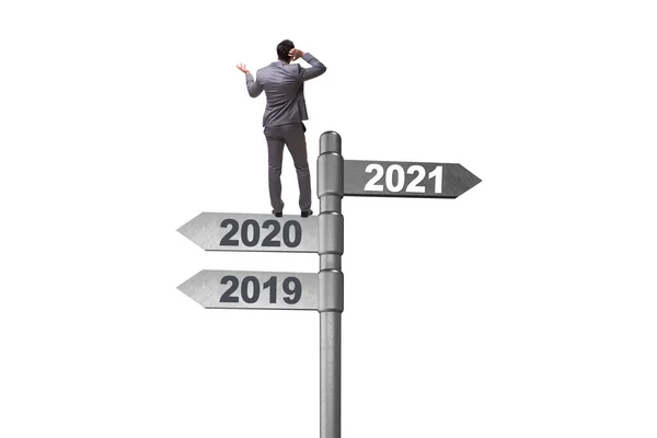 Road sign and businessman with 2020 and 2021 — Stock Photo, Image