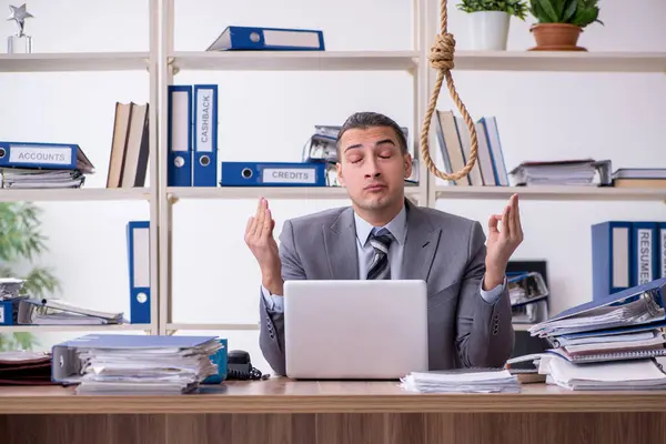 Young male employee committing suicide at workplace — Stock Photo, Image