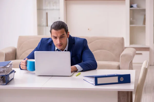 Young male employee working from home in pandemic concept — Stock Photo, Image