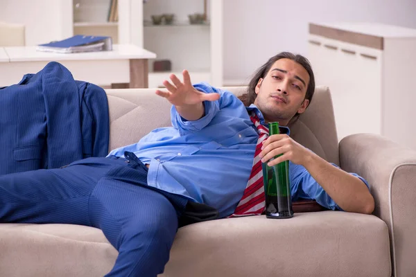 Young male employee being fired from his work at home — Stock Photo, Image