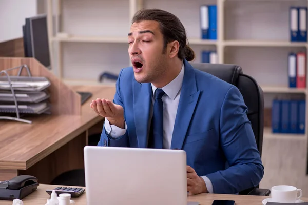 Young sick businessman employee suffering at workplace — Stock Photo, Image