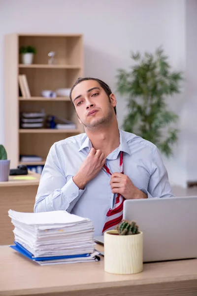 Young male employee in time management concept — Stock Photo, Image