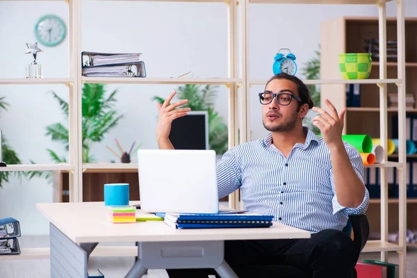 Young male employee working in the office — Stock Photo, Image