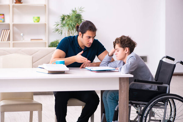 Father and disabled son in education concept