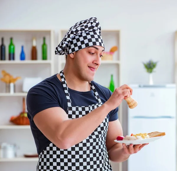 Chef cook cooking a meal breakfast dinner in the kitchen — Stock Image Chef cook cooking a meal breakfast dinner in the kitchen Royalty Free Stock Images