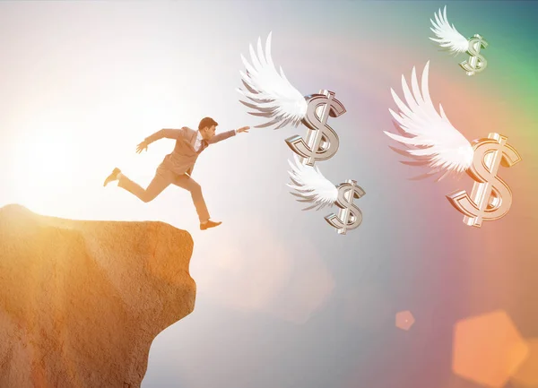ビジネスコンセプトで天使のドルを追いかけるビジネスマン — ストック写真