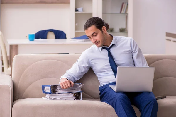 Young male employee working from home in pandemic concept — Stock Photo, Image