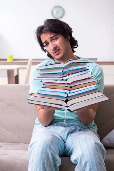 Young male student unhappy with excessive work at home — Stock Photo, Image
