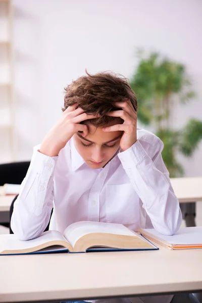 Schoolboy preparing for exams in the classroom — Stock Photo, Image
