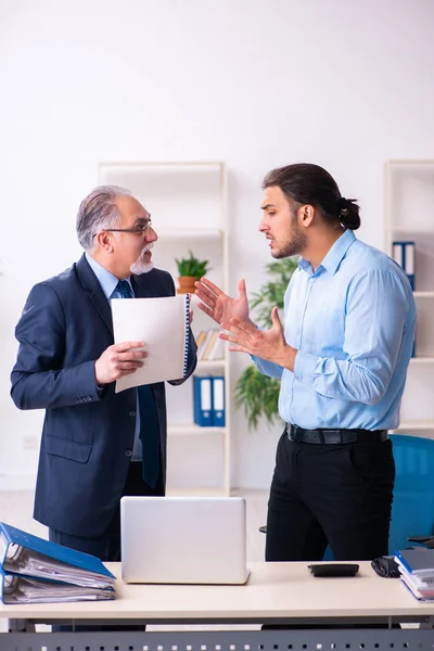 Old boss and his young assistant in the office — Stock Photo, Image