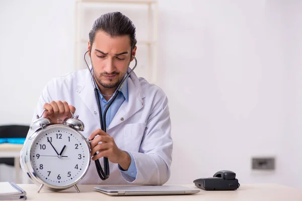 Young handsome male doctor working in the clinic — Stock Photo, Image
