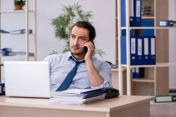 Young male bookkeeper working in the office — Stock Photo, Image