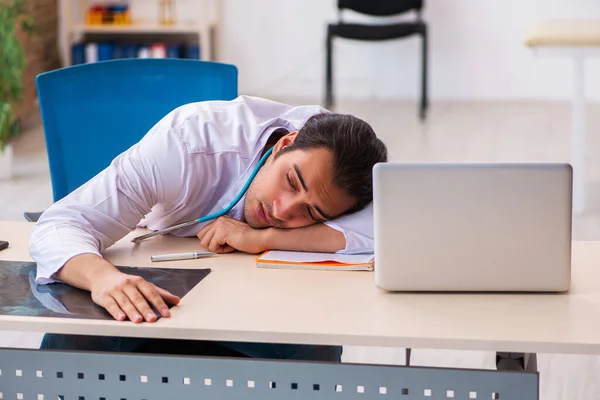 Young male doctor working in the clinic — Stock Photo, Image