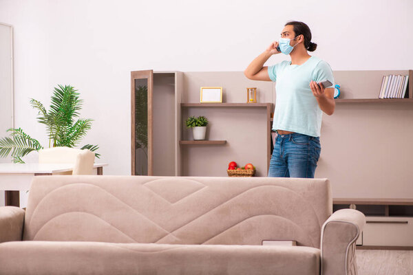 Young man boring at home during pandemic