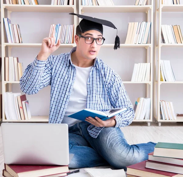 Young student studying with books — Stock Photo, Image