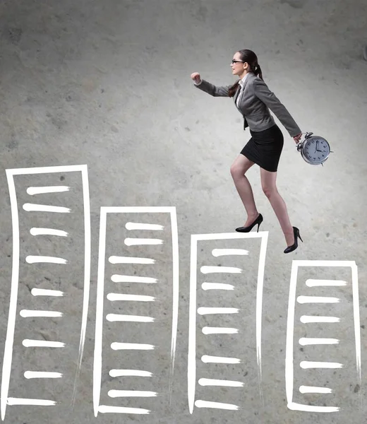 Businesswoman climbing career ladder in business concept