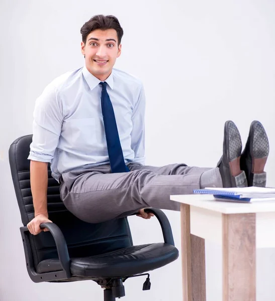 Businessman doing sports in office during break — Stock Photo, Image