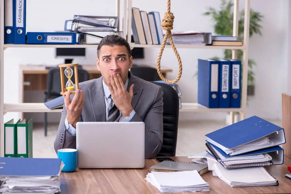 Young male employee committing suicide at workplace — Stock Photo, Image