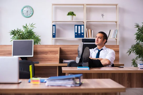 Young male employee working in the office — Stock Photo, Image