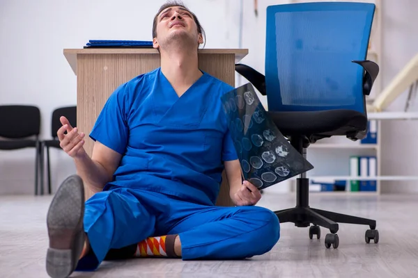 Young male doctor radiologist being unhappy after night shift — Stock Photo, Image